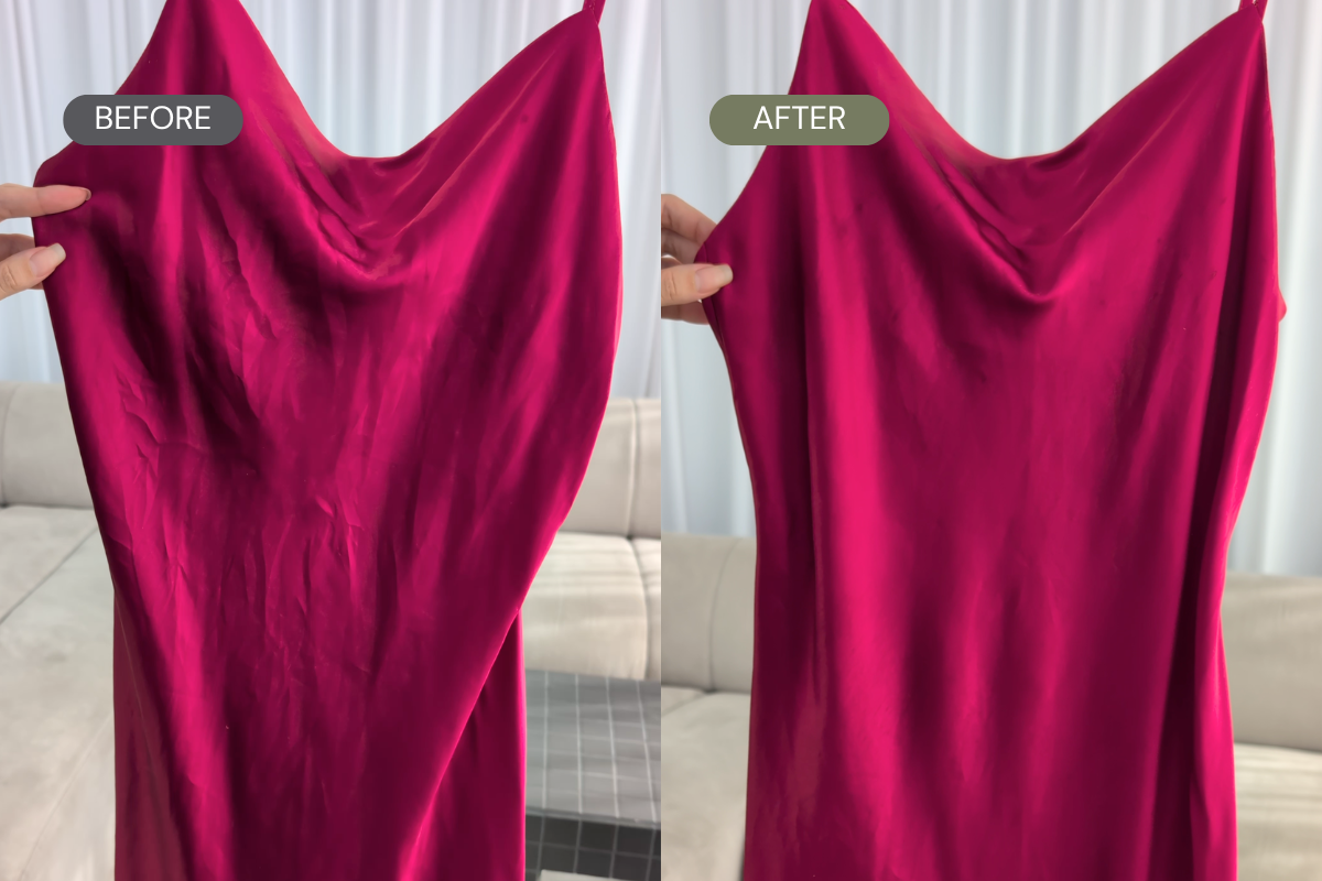 A side-by-side before and after comparison showing a bright fuchsia pink satin fabric being held up by hands in front of a light-colored sofa and curtains. The left side is labeled BEFORE and appears wrinkled, while the right side is labeled AFTER and appears smoother.
