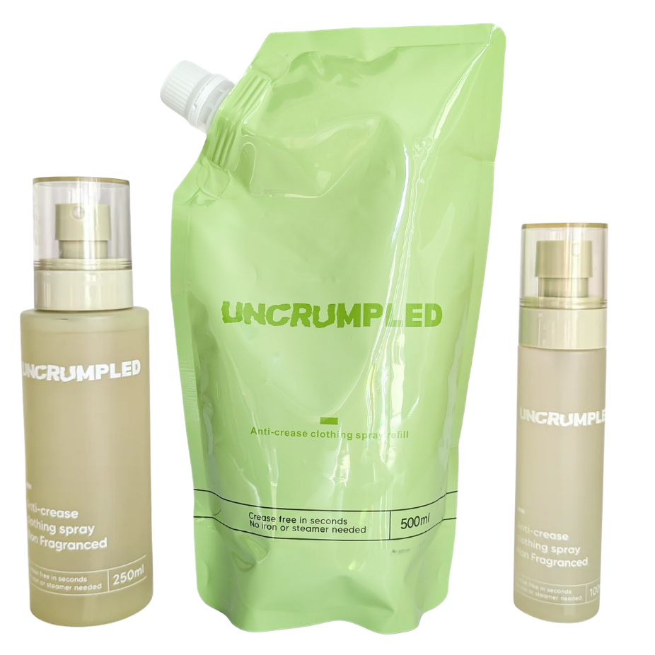 Uncrumpled's anti-crease range products on a plan white background: the regular-sized spray bottle, the large green refill pouch, and the travel-sized spray bottle.